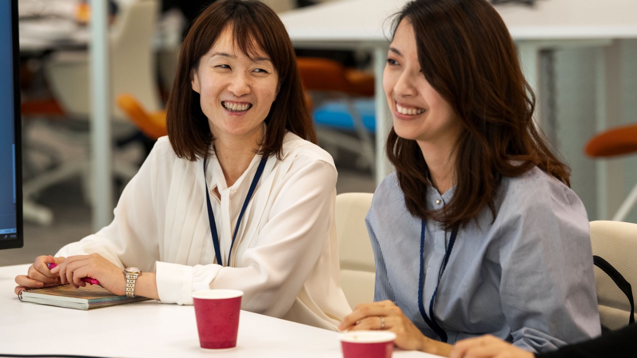 two women smiling 