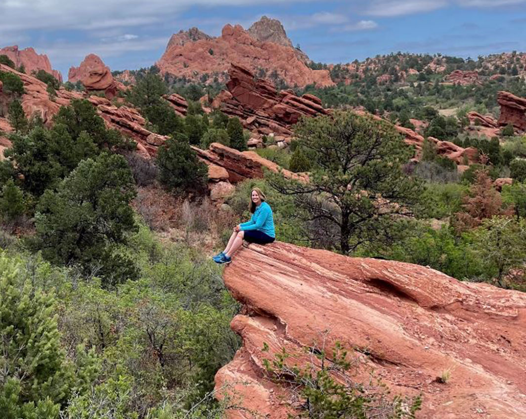 woman sitting on ledge