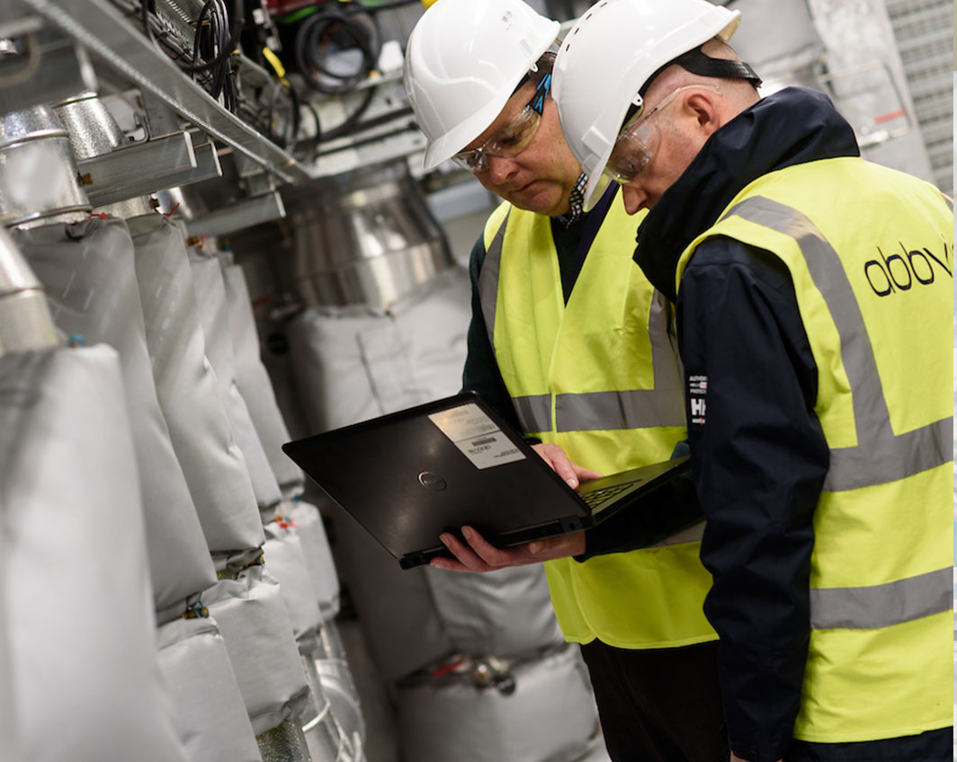 two men inspecting machine