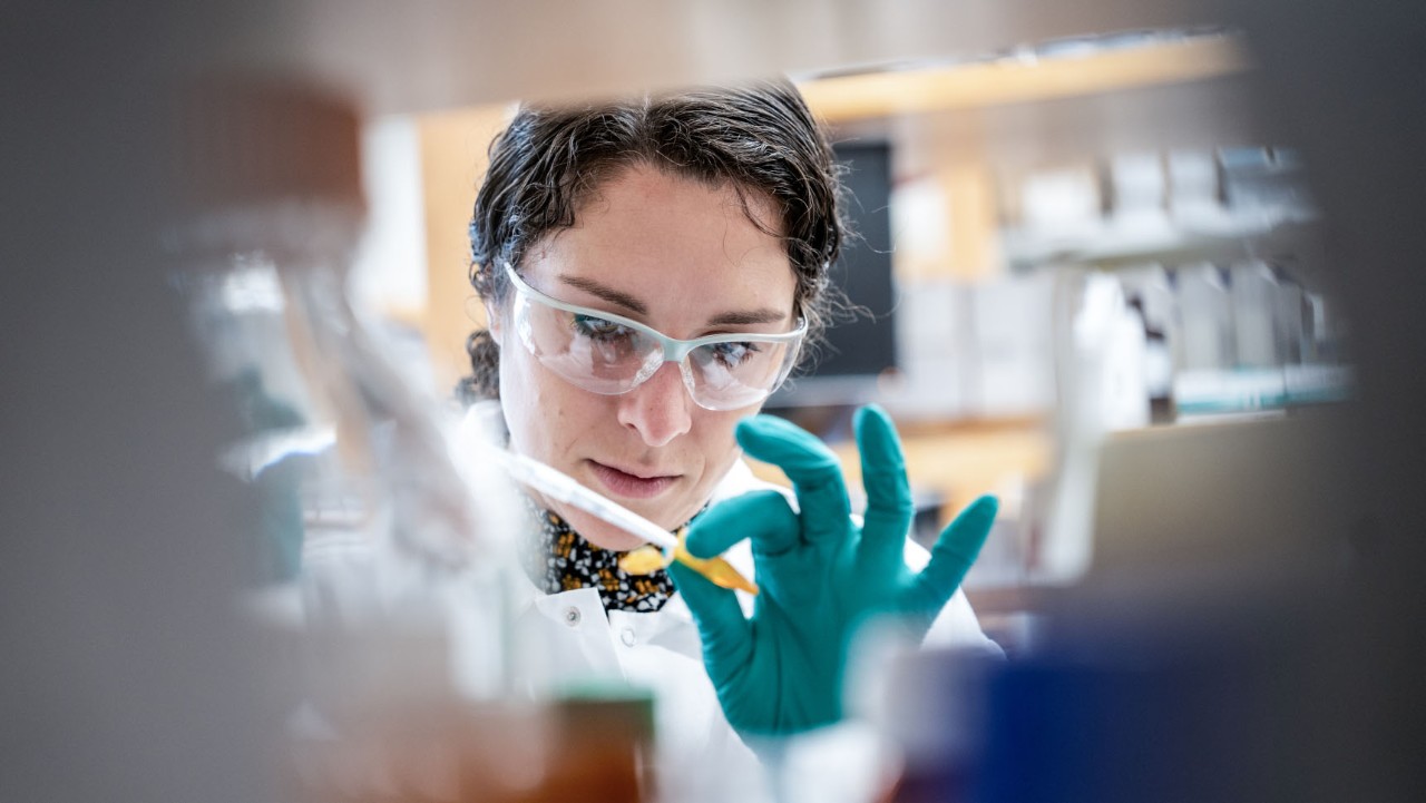 woman holding a pipette